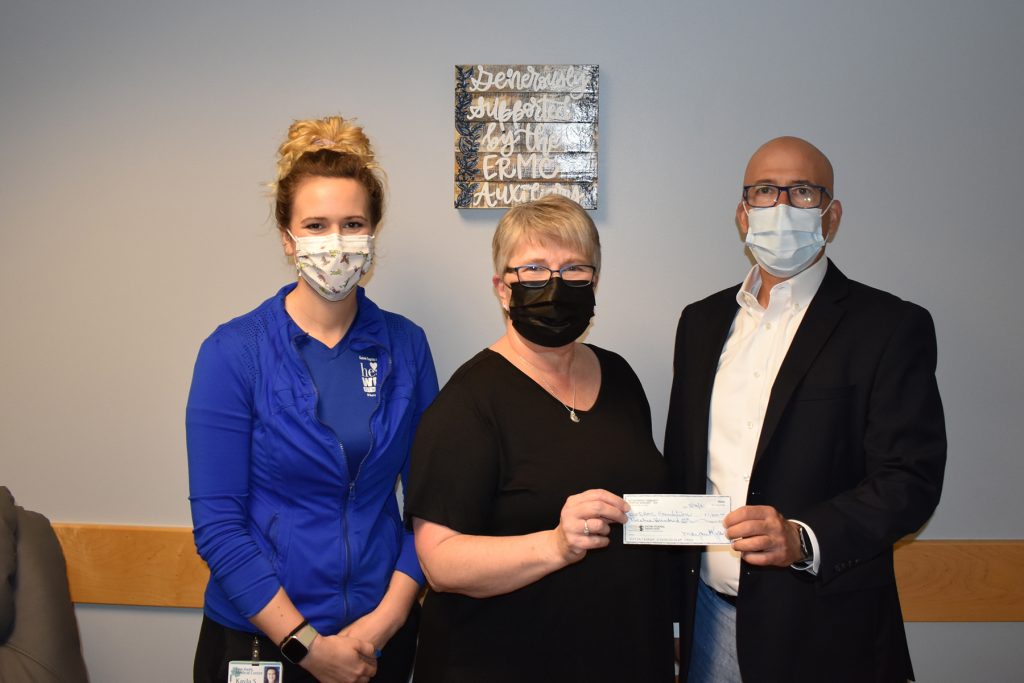 HealthWorks Fitness Center manager Kayla Smith, ERMC Auxilian Nancy Pople, and ERMC president and chief executive officer Tim Johnson.