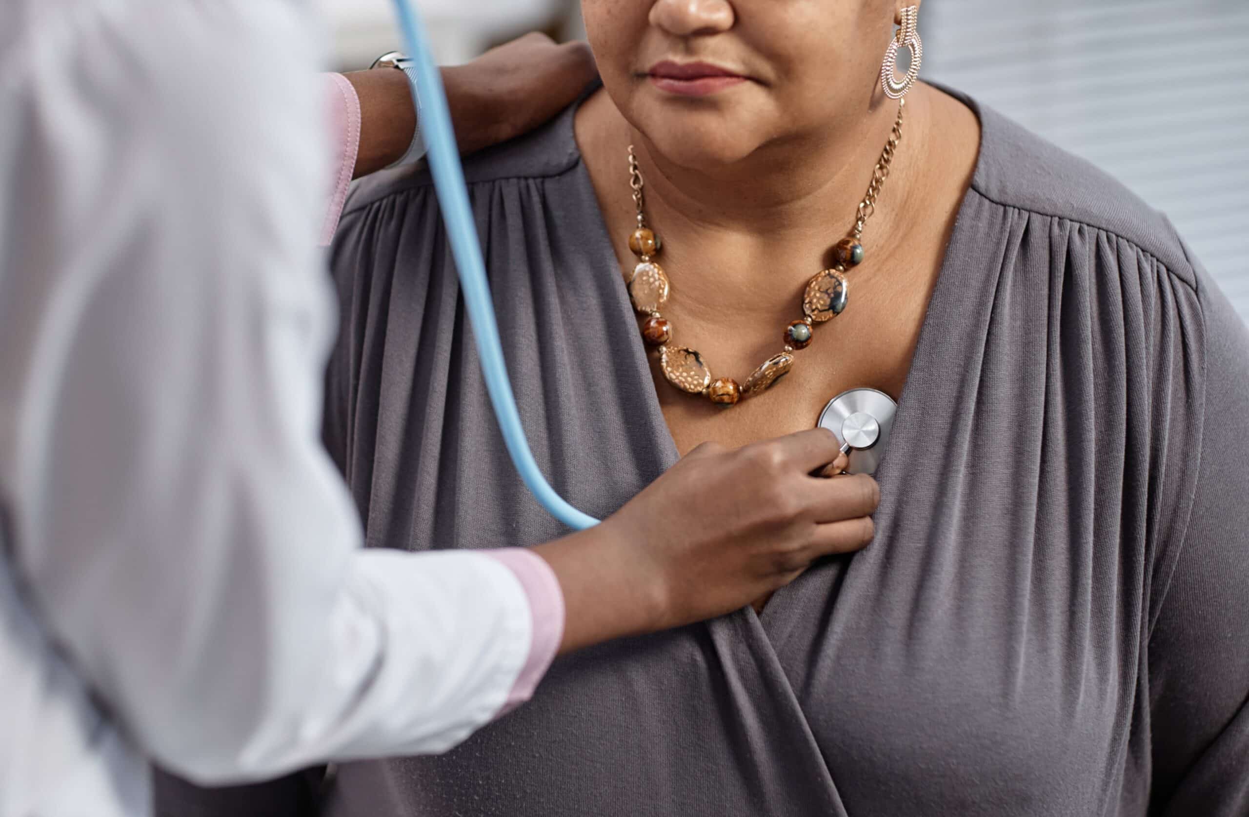 Cardiology provider with patient at Eaton Rapids Medical Center - woman with stethoscope